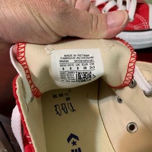 Converse low top tennis shoes, women’s 8, red